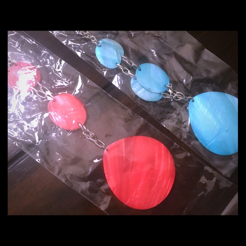 long shell made necklace in blue and one in red,